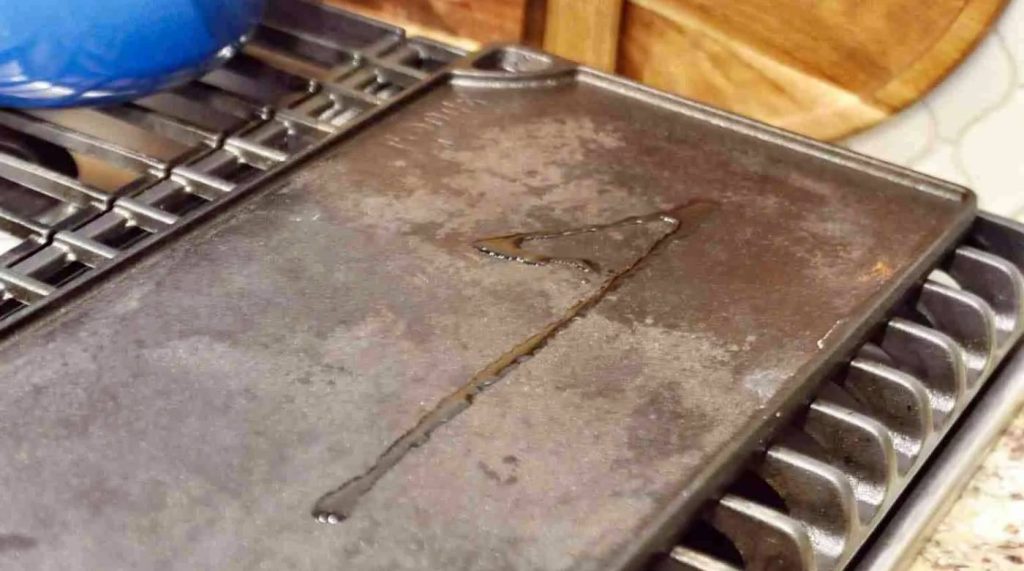 limpiar una plancha de cocina de hierro oxidada